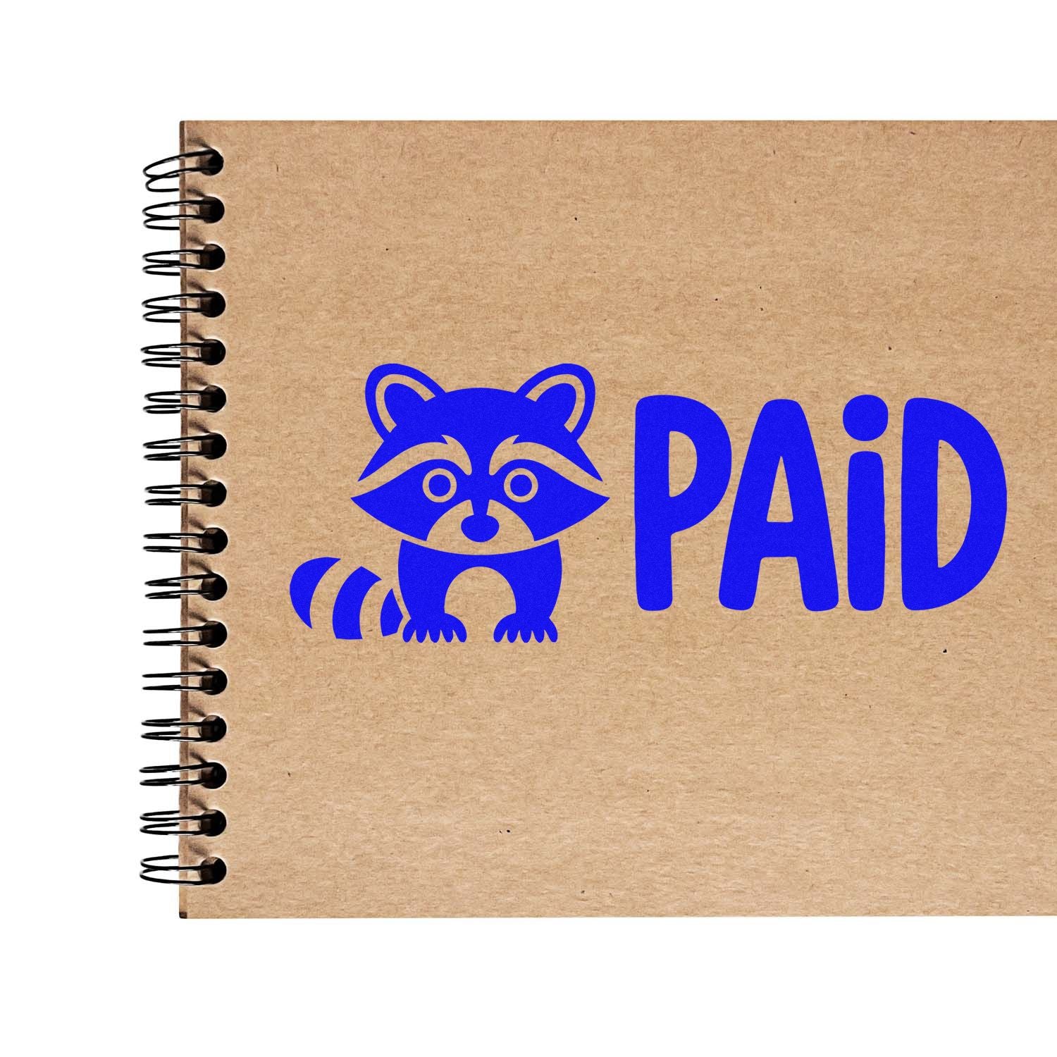 Blue raccoon PAID rubber stamp design for business accounting and invoice marking on a kraft notebook cover