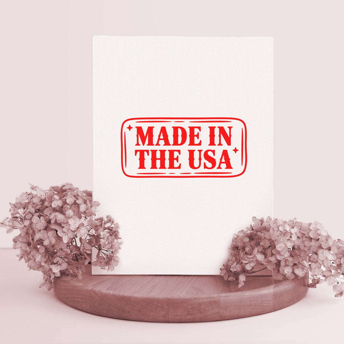 Made in the USA rubber stamp on white canvas mockup, perfect for patriotic branding and handmade products.