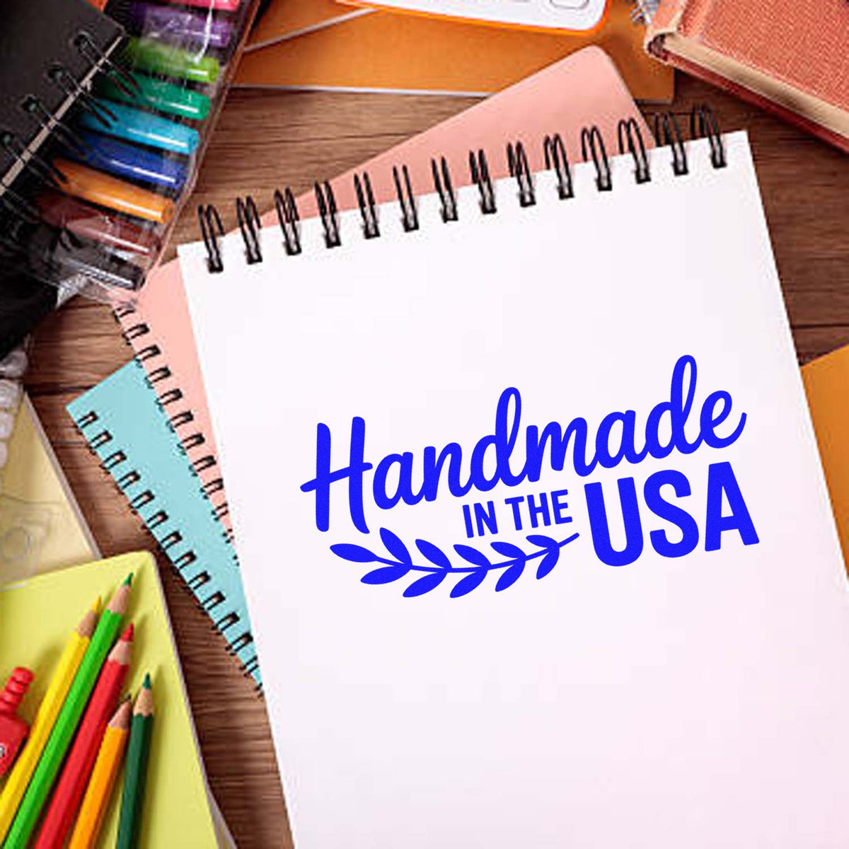 Handmade in the USA rubber stamp design on notebook, ideal for DIY crafts, packaging, and small business branding.