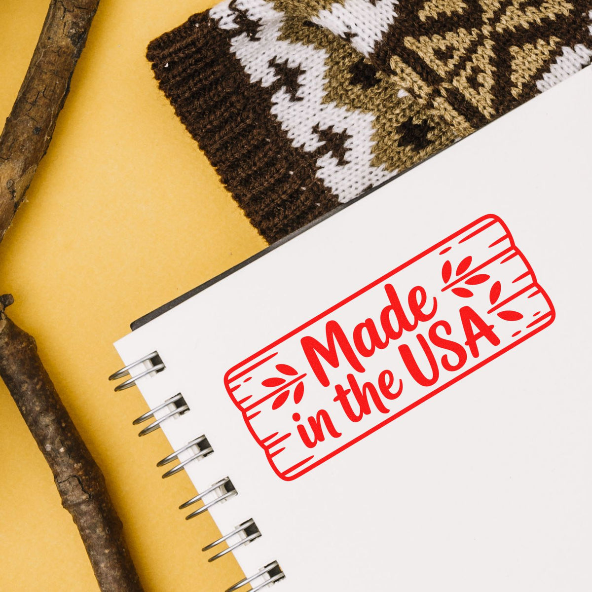 Made in the USA rubber stamp on a spiral notebook, ideal for patriotic branding and custom product packaging.