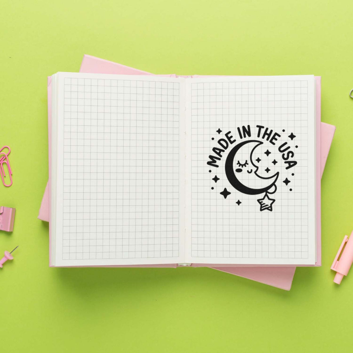 Made in the USA moon and stars rubber stamp impression in a notebook, perfect for custom handmade stationery and craft projects.