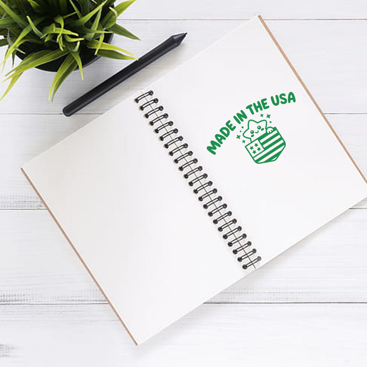 Made in USA rubber stamp design on spiral notebook for custom branding, product packaging, and craft projects.