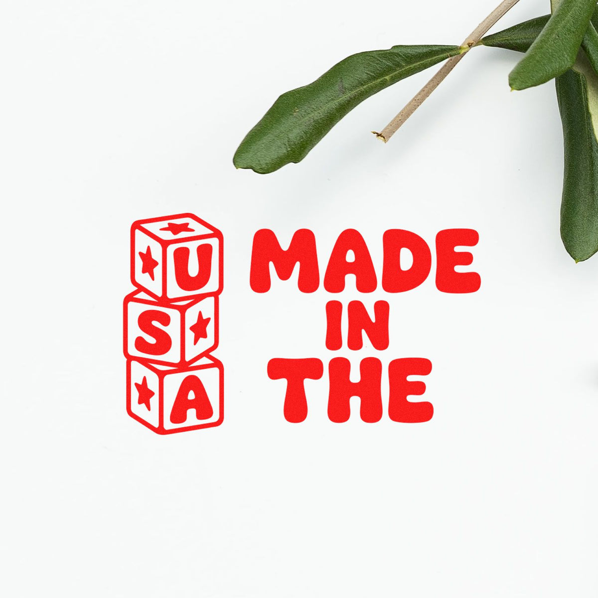 Made in the USA rubber stamp design with bold red block letters and cube icon, ideal for product packaging and branding.