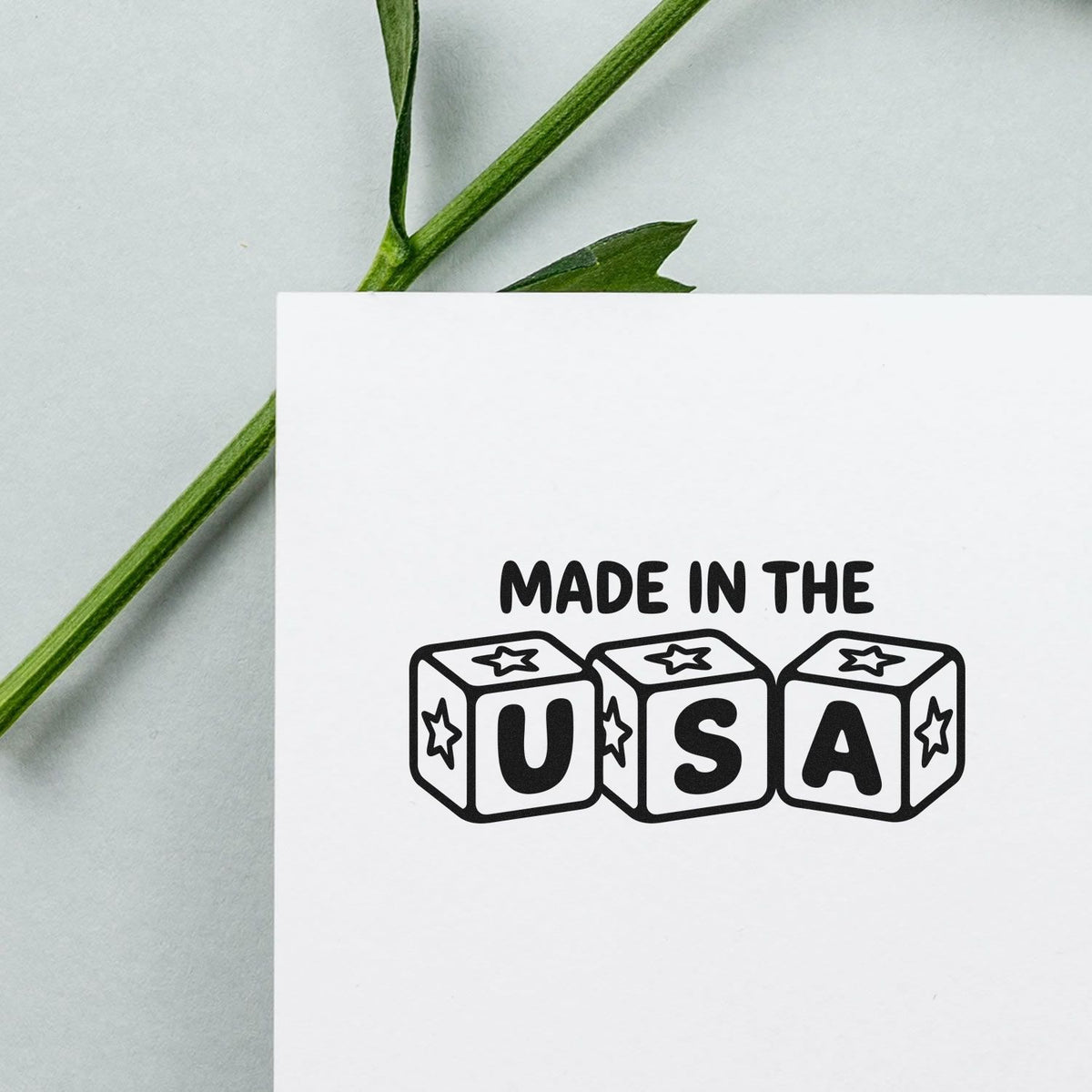 Made in the USA rubber stamp design with bold block letters and stars for patriotic packaging, crafts, and branding.