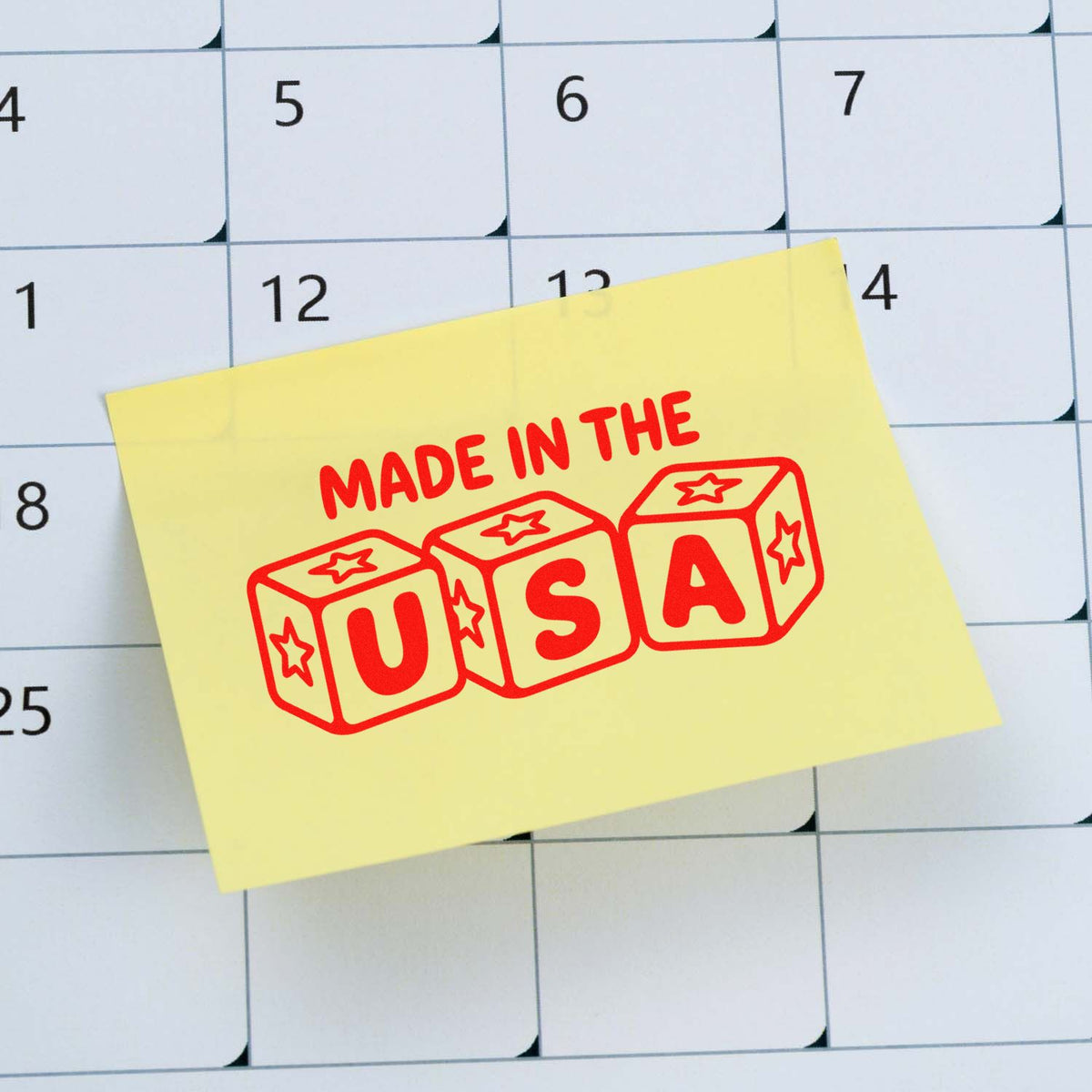 Made in USA rubber stamp design on sticky note over calendar, ideal for labeling U.S.-made products and packaging.