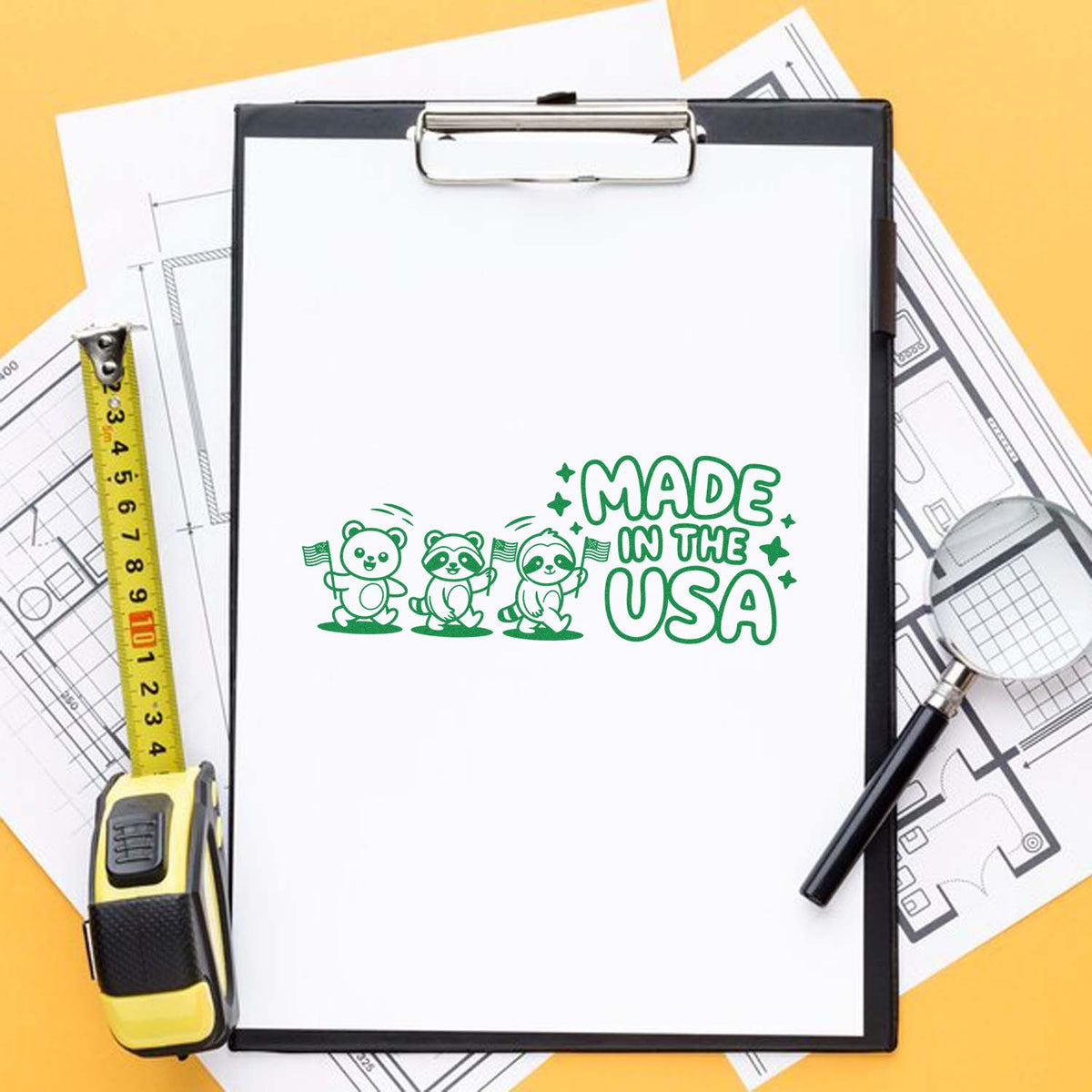 Made in the USA custom rubber stamp design on clipboard with blueprint tools, ideal for American-made product branding.