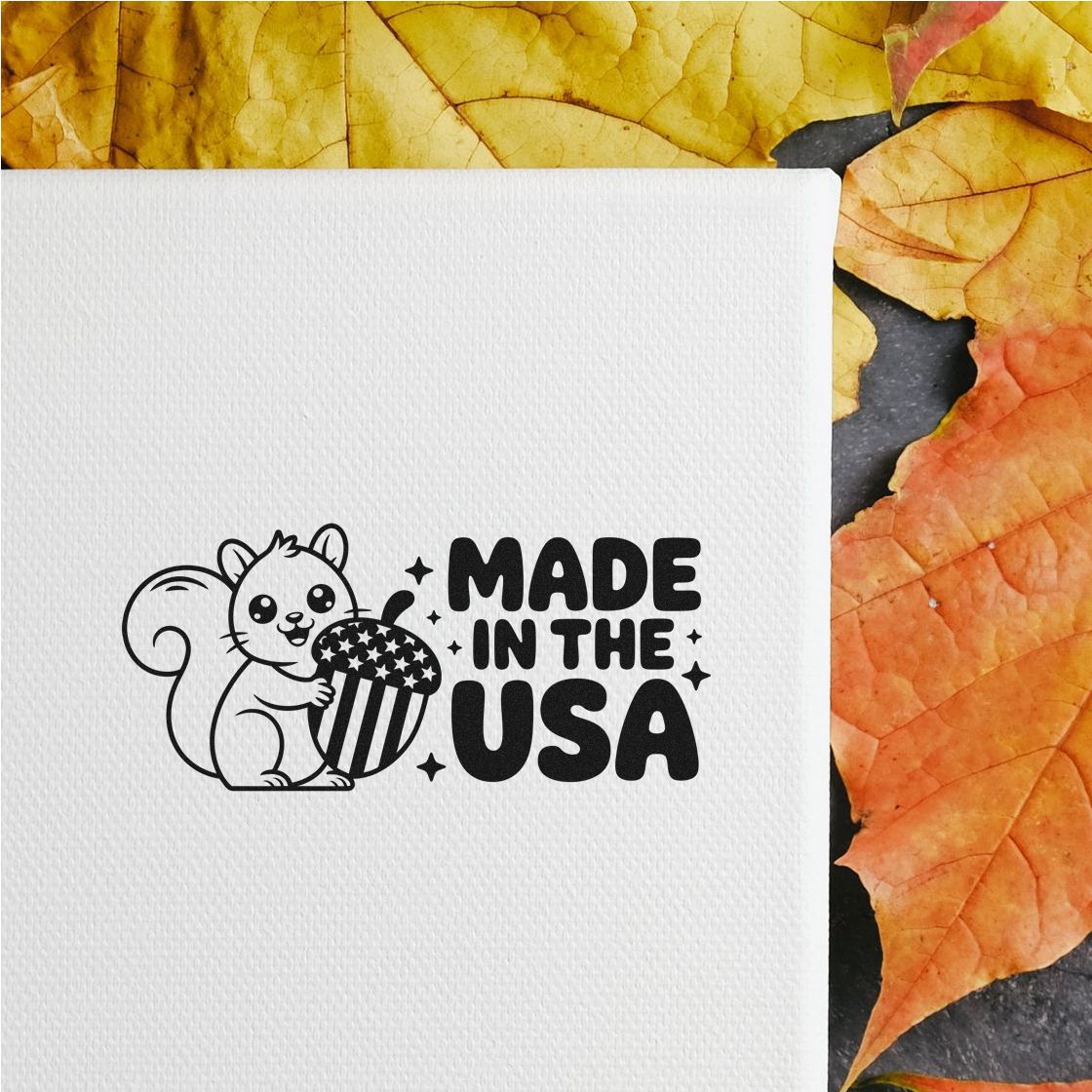 Made in the USA rubber stamp with squirrel and acorn design on white paper, ideal for patriotic craft projects.