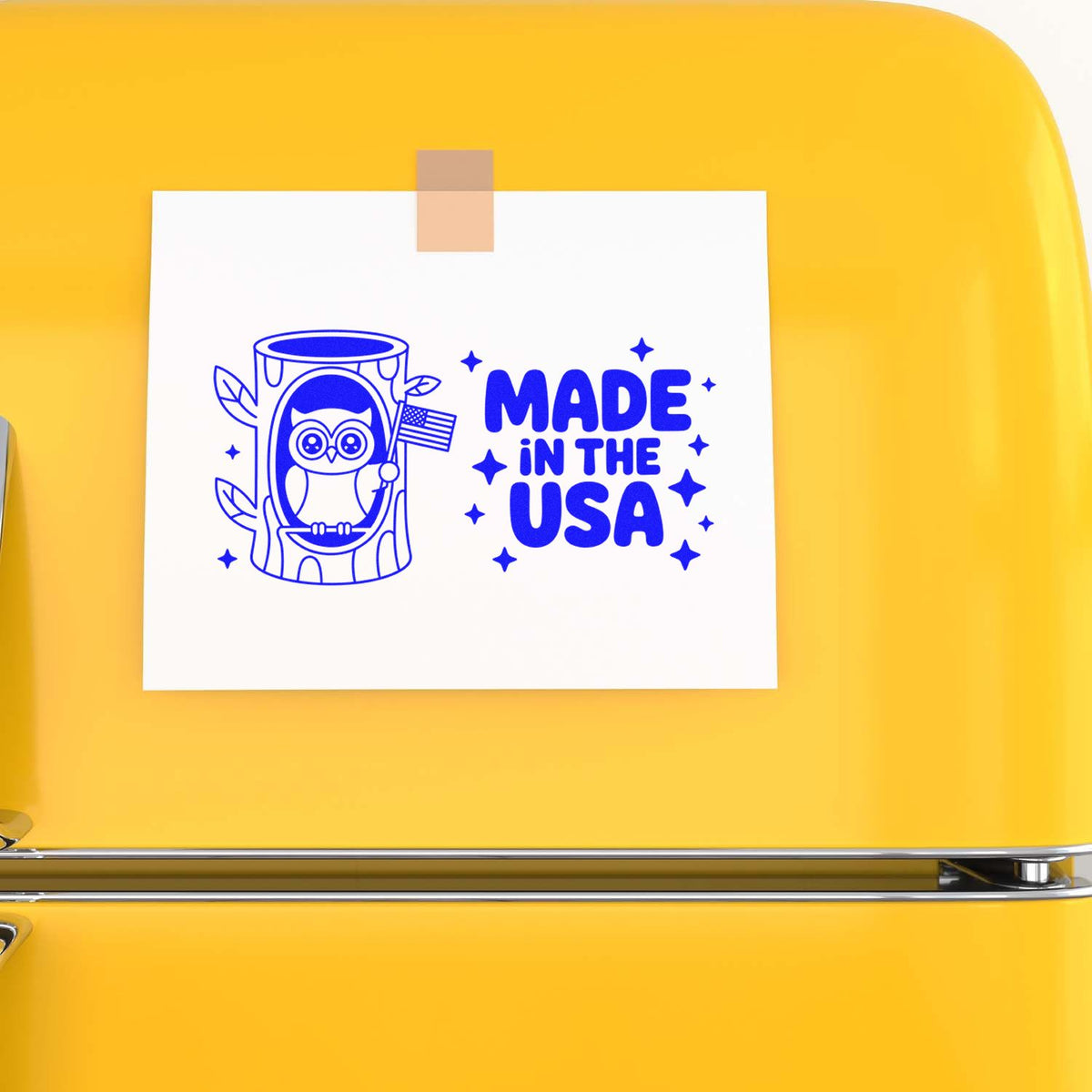 Made in the USA owl rubber stamp design on white paper taped to a yellow fridge