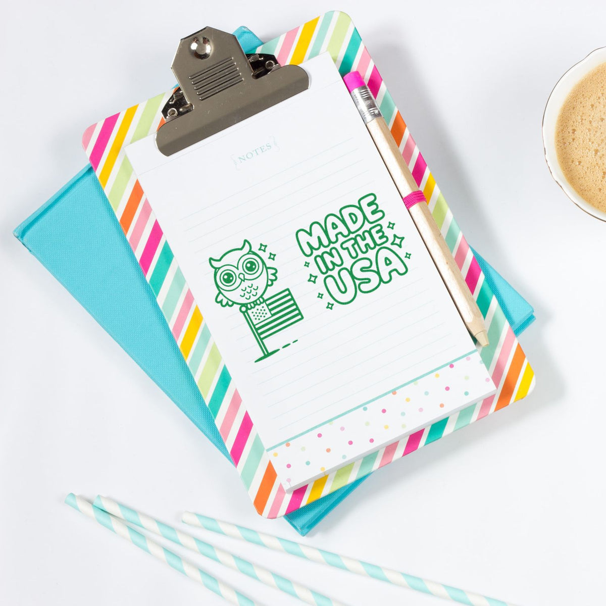 Patriotic Made in the USA rubber stamp impression on a notepad clipboard with owl and American flag design.