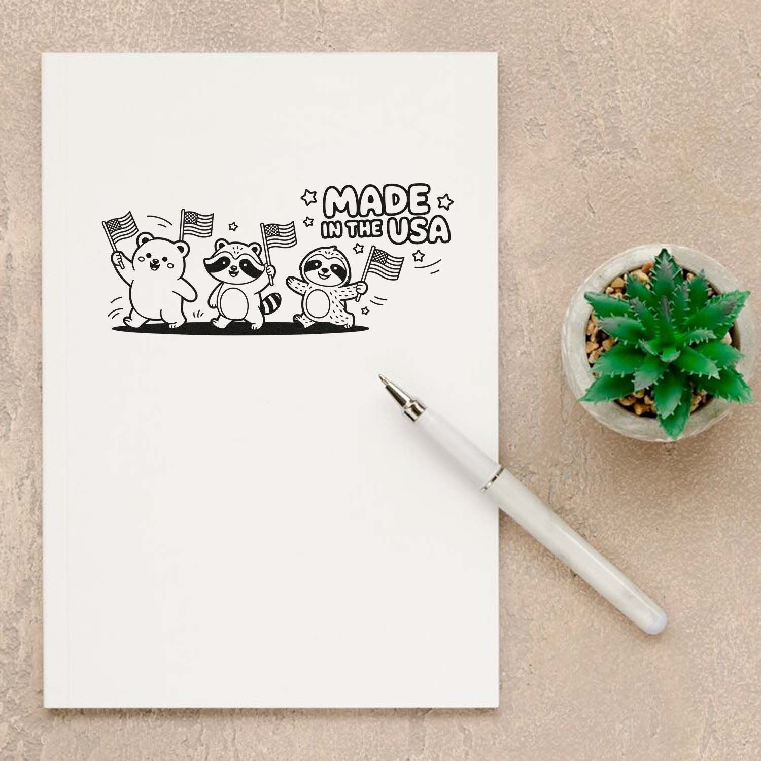 Made in the USA rubber stamp design featuring cute animals waving American flags on stationery paper.