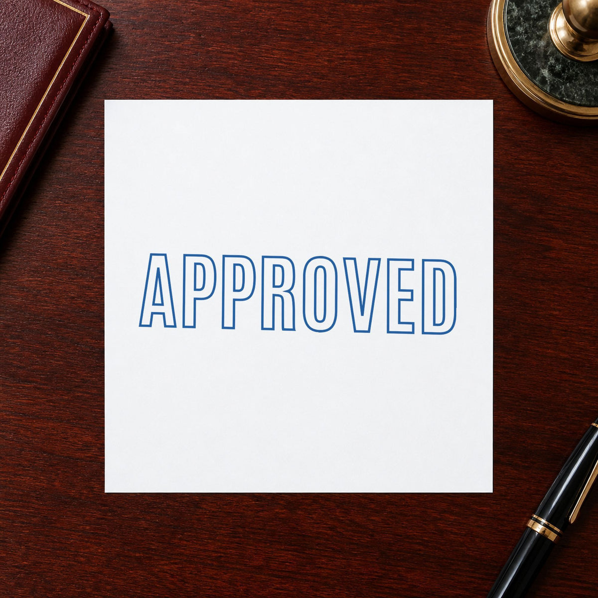 "Approved" imprint stamped on a document with the Xstamper Approved Stamp