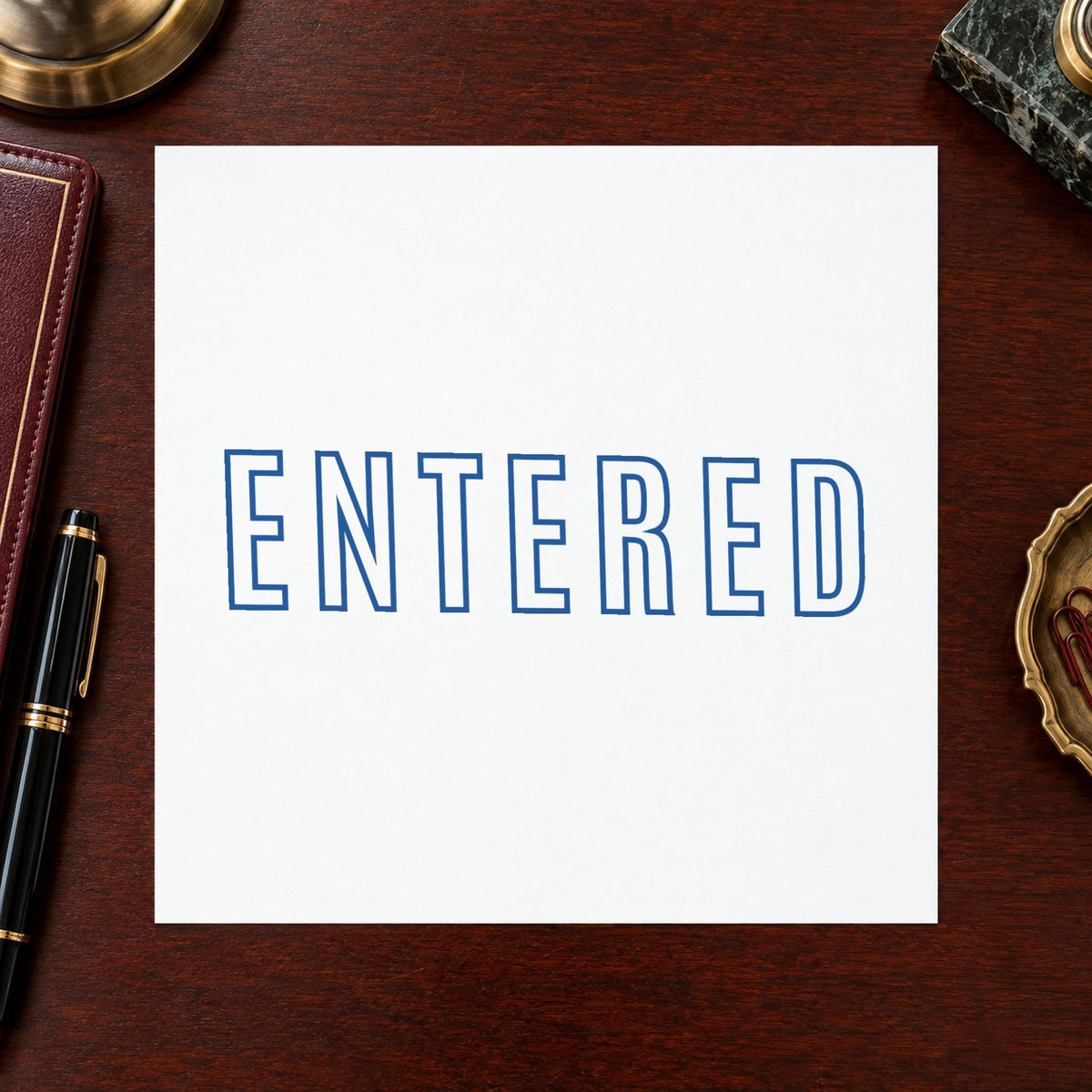 "Entered" stamp mark in everyday office use, Xstamper 1021