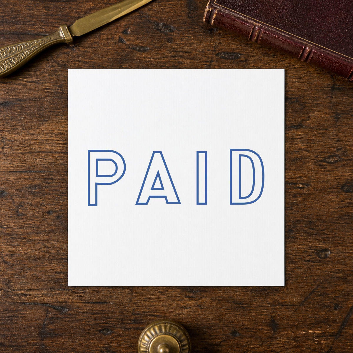Marking a page "Paid" with the Small Paid Stamp