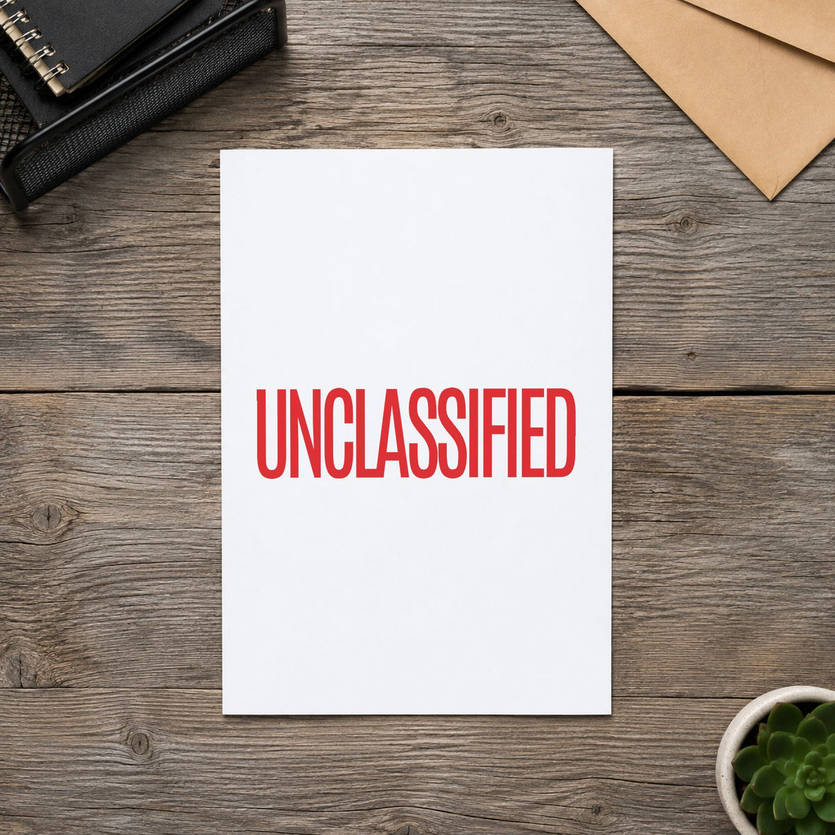 "Unclassified" mark added to paperwork with a pre-inked Xstamper stamp