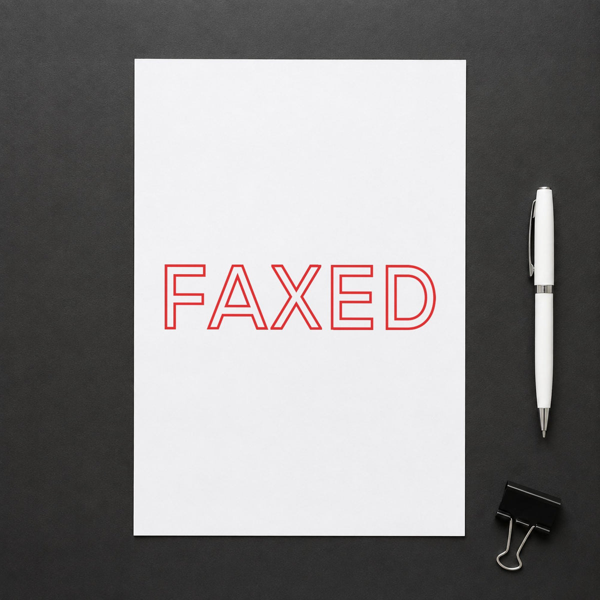 "Faxed" imprint stamped on a document with the Faxed Stamp For Fax Paperwork – Red Pre-Inked Xstamper