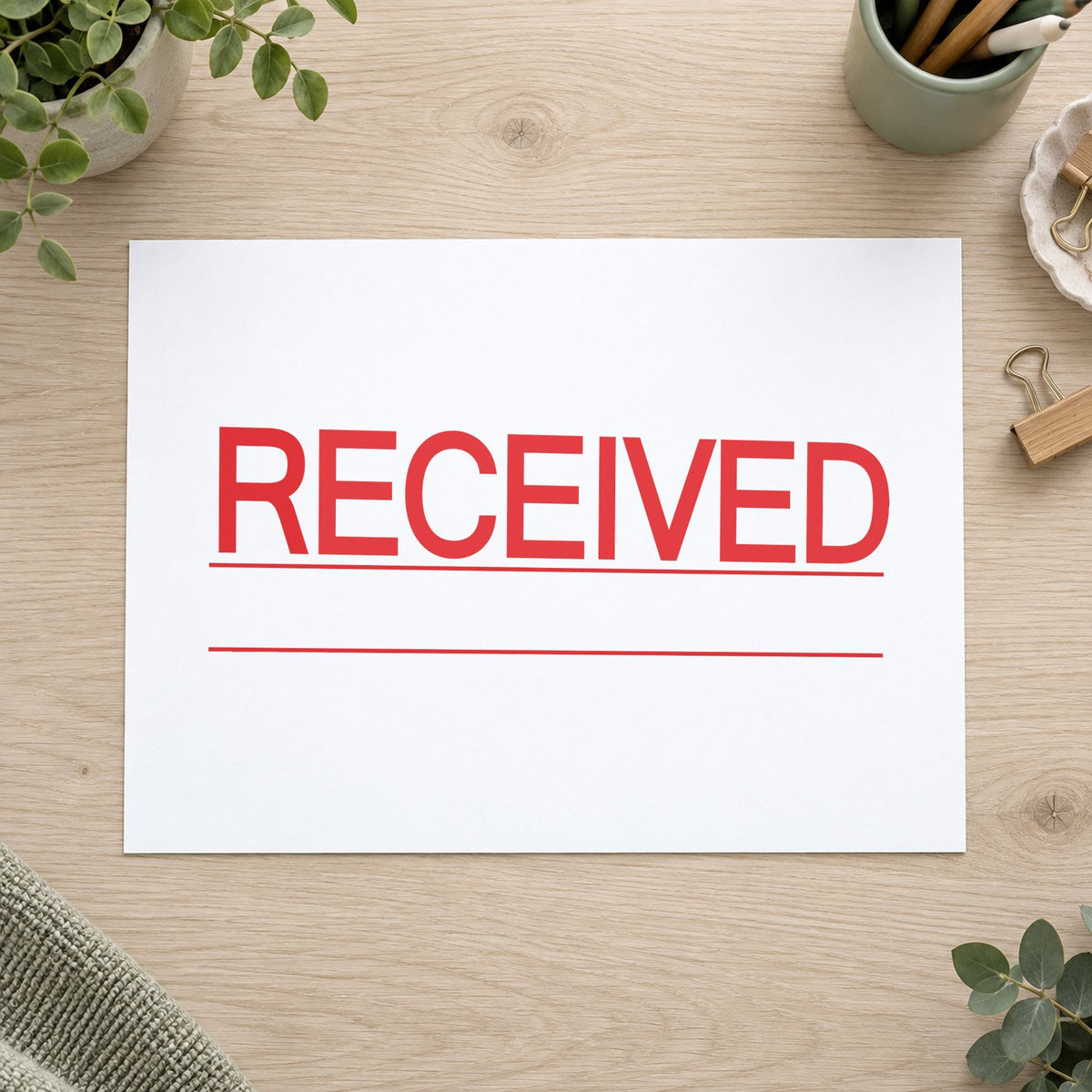 Marking a page "Received" with the Received Stamp For Document Intake – Jumbo Bold Red Pre-Inked Xstamper