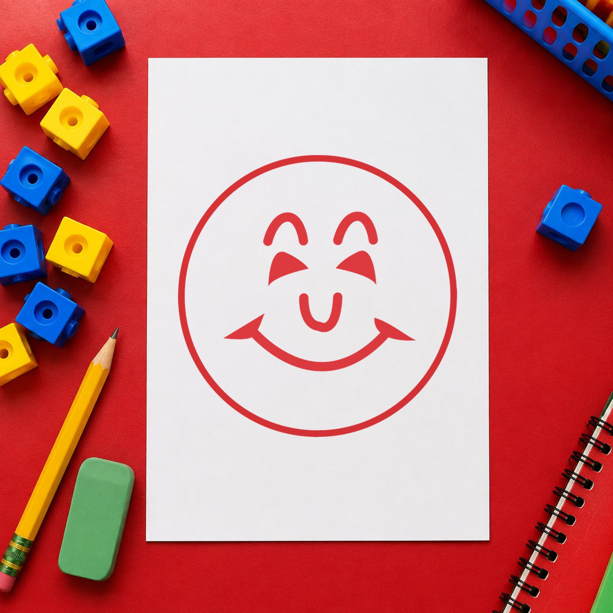 "Smiley face" imprint stamped on a document with the Round Red Smiley Face Teacher Stamp
