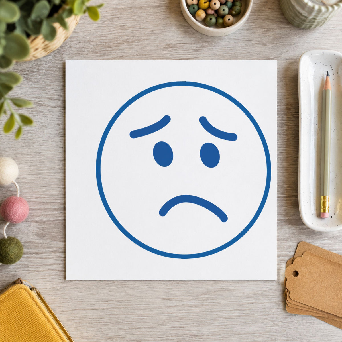 "Frown face" imprint at 5/8 in diameter, no separate ink pad required