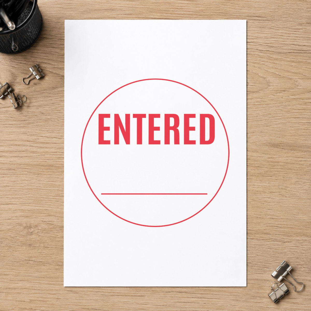 "Entered" imprint stamped on a document with the Entered Stamp For Data Entry Records – Round Pre-Inked Xstamper