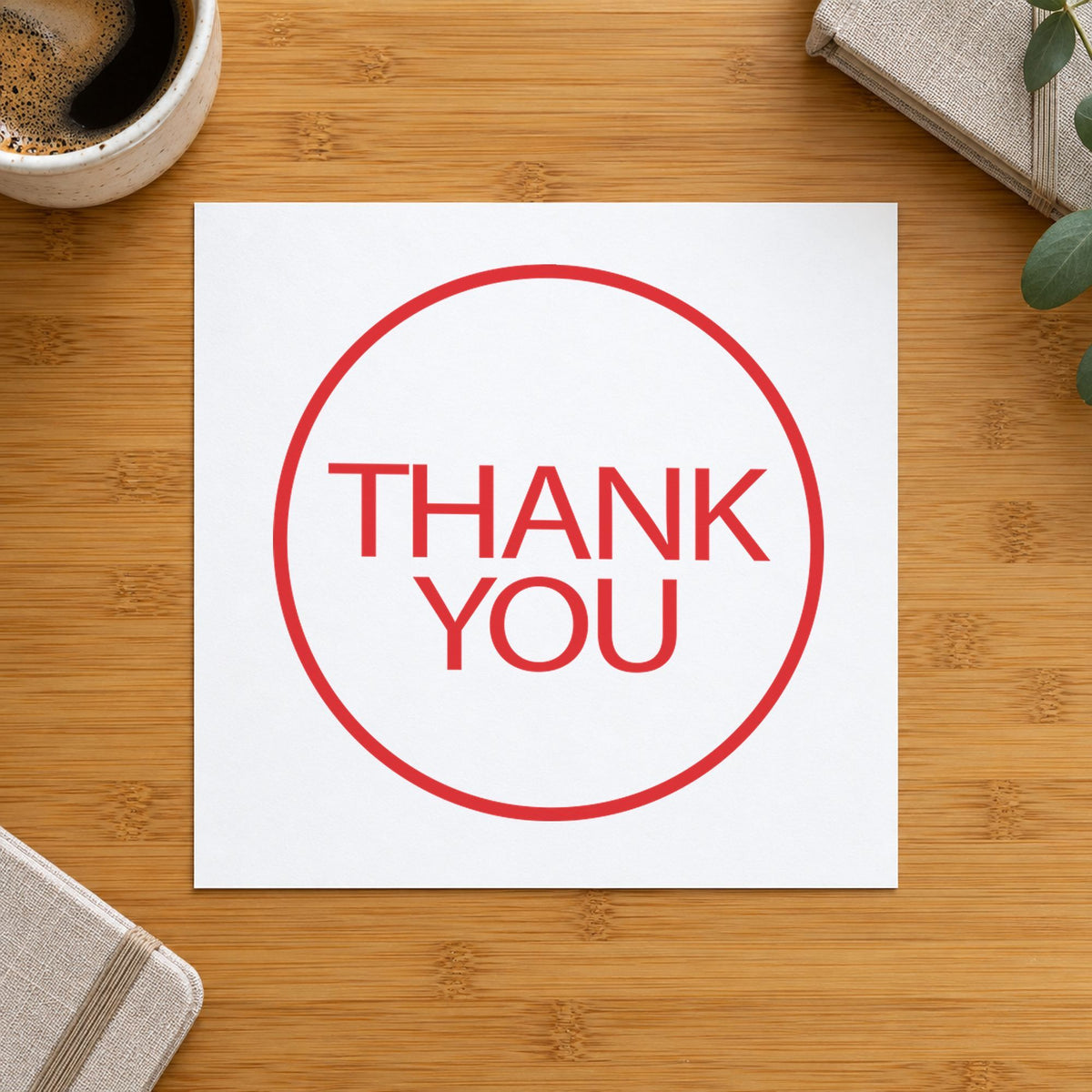 "Thank you" imprint stamped on a document with the Xstamper Thank You Appreciation Stamp – Round Red Pre-Inked