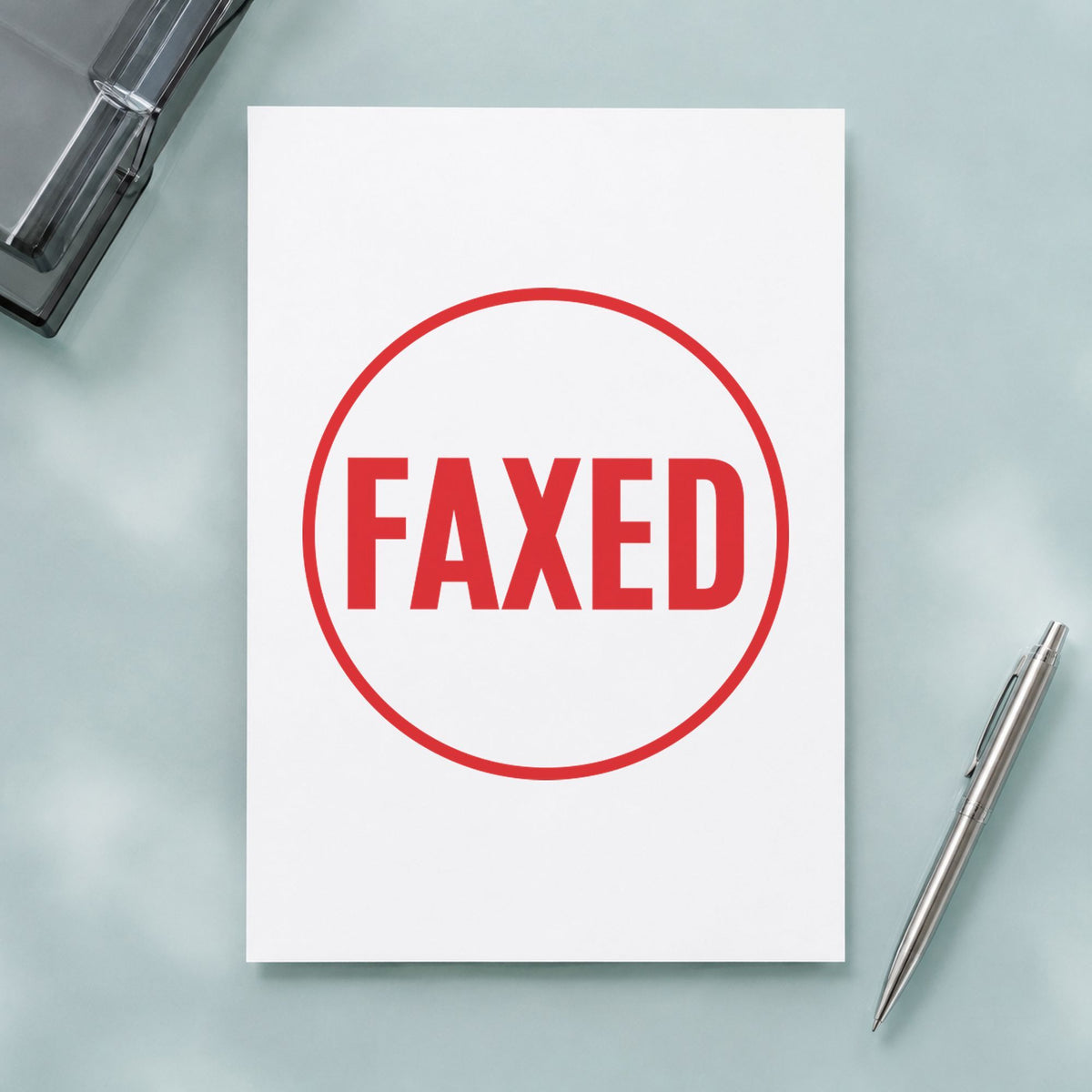 "Faxed" imprint stamped on a document with the Xstamper Faxed Record Stamp – Round Pre-Inked