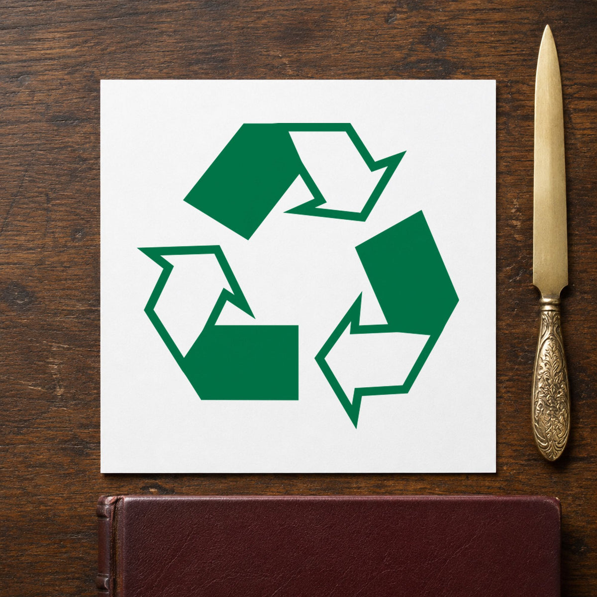 "Recycle logo" impression shown close up, round imprint at 5/8 in diameter