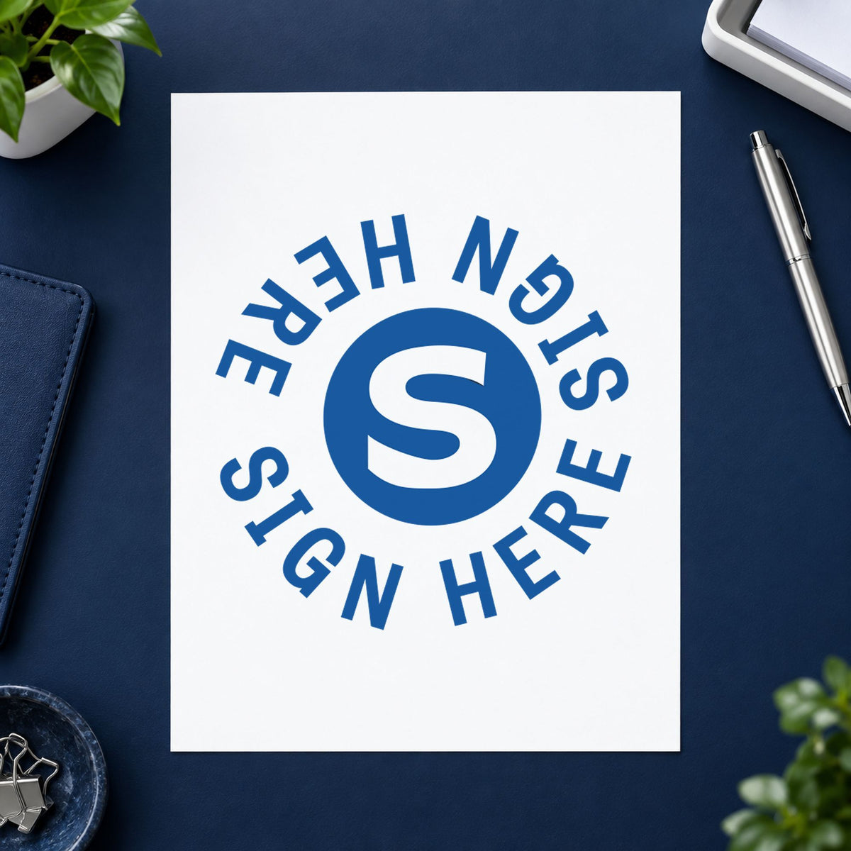 Crisp "Sign here" imprint produced by the Xstamper Sign Here Stamp – Round Blue Pre-Inked