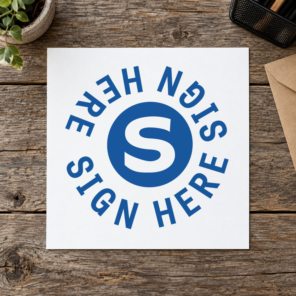 Marking a page "Sign here" with the Xstamper Sign Here Stamp – Round Blue Pre-Inked