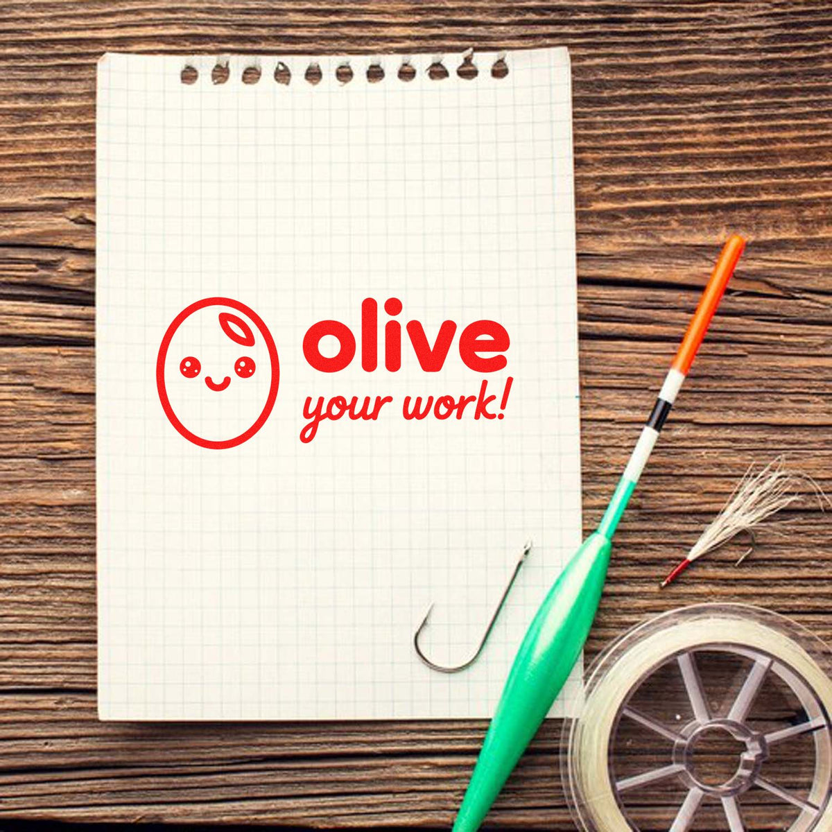 Cute Olive your work rubber stamp design on notebook, ideal for teacher, planner, and craft stamping projects.