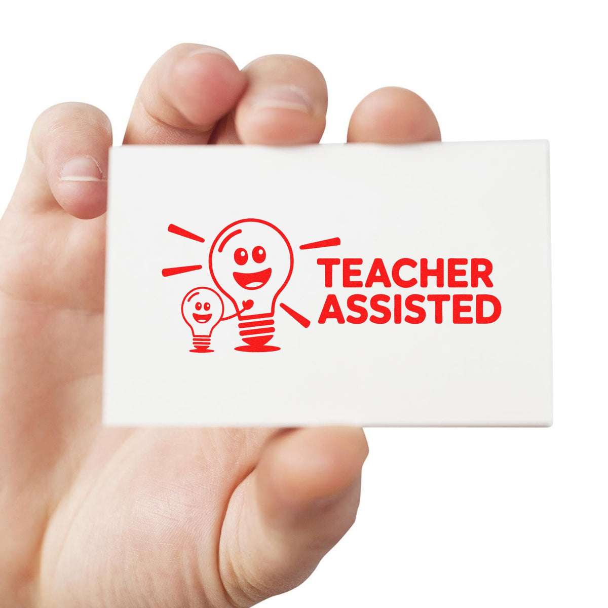 Teacher Assisted rubber stamp held in hand for classroom grading, feedback, and education paperwork.