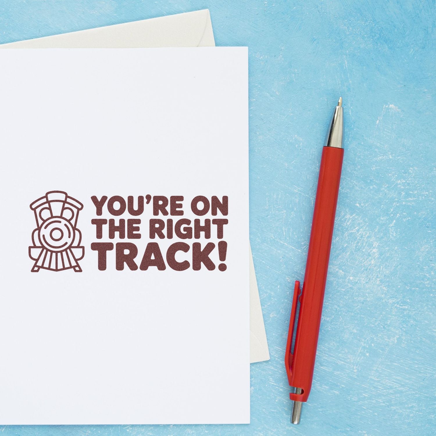 Rubber stamp design reading Youre on the right track! with train icon, ideal for encouragement cards, teacher gifts, and planners.