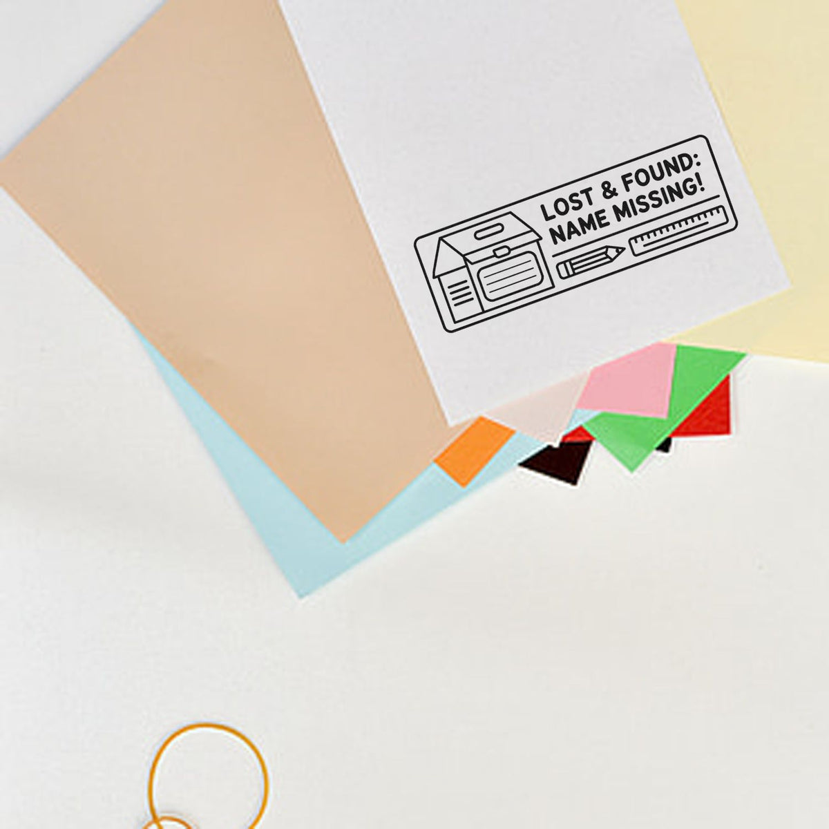 Lost & found rubber stamp reading Name Missing on paper, for labeling school supplies, office items, and personal belongings.