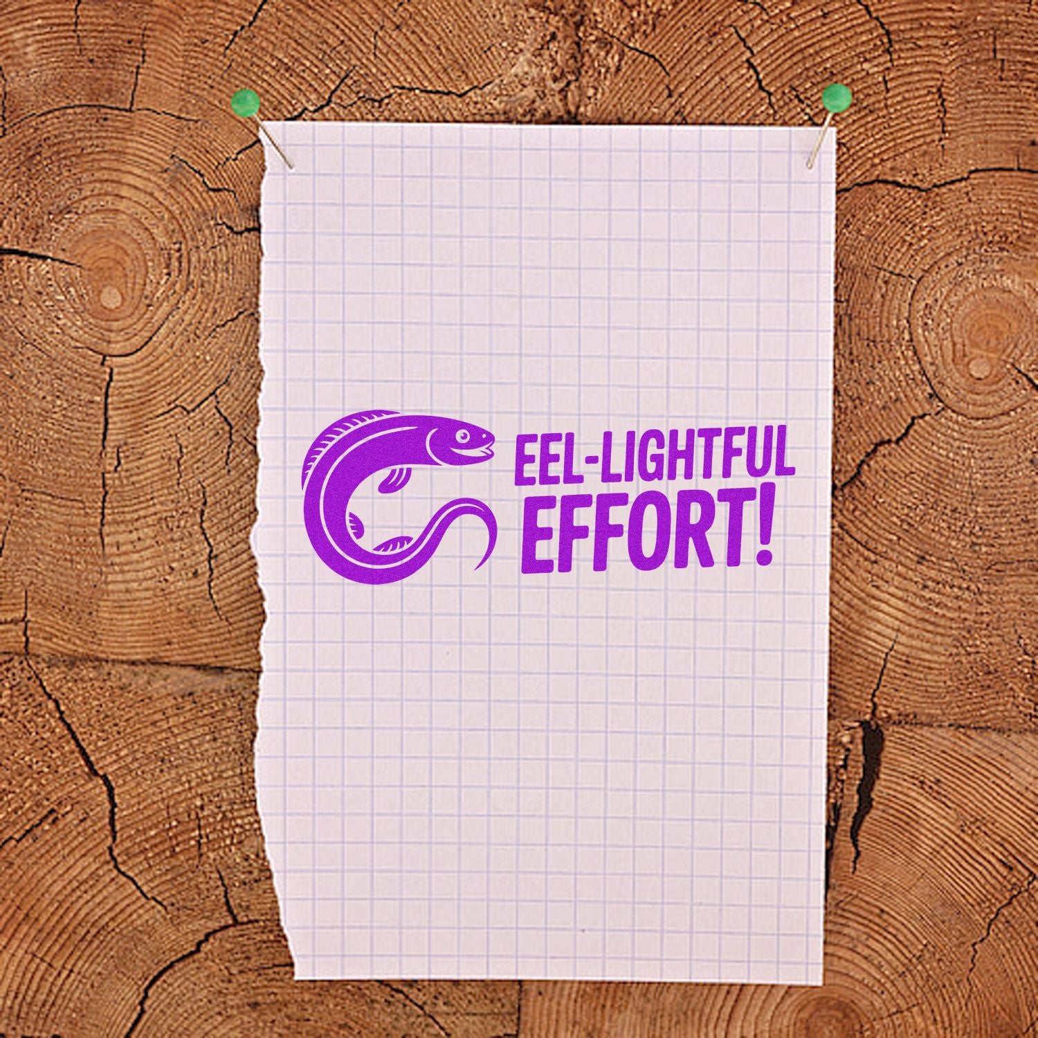 Purple Eel-lightful Effort! rubber stamp design on pinned graph paper with wood background.