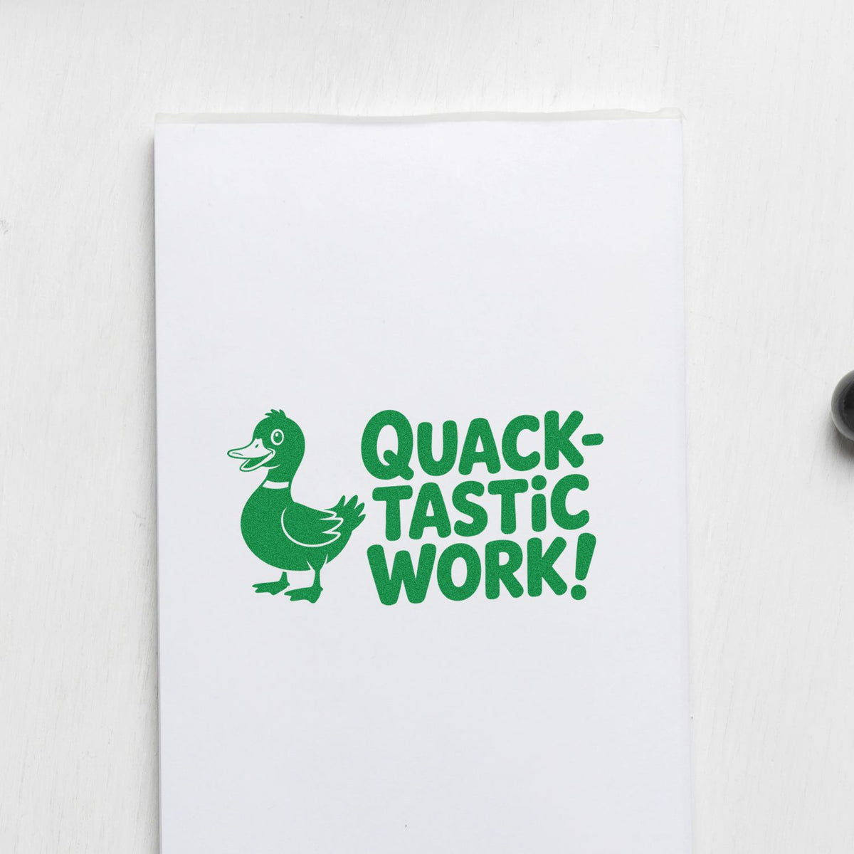 Green duck Quacktastic Work! rubber stamp design on white paper, perfect for teacher reward cards and office notes.