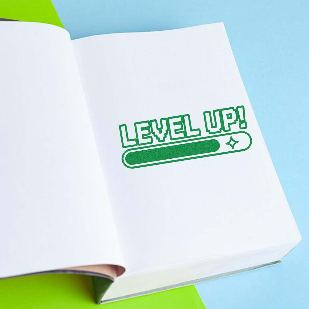 Motivational rubber stamp design reading Level Up! with progress bar on notebook page for custom branding.