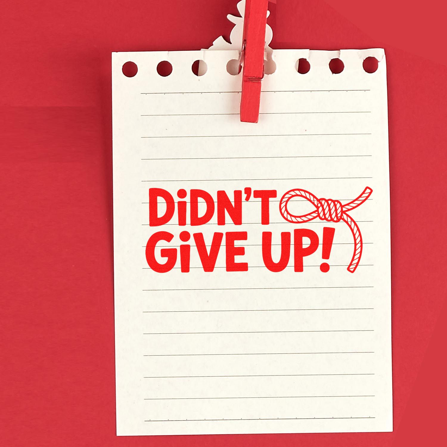 Motivational rubber stamp design reading Didnt Give Up! with rope knot graphic on lined note paper.