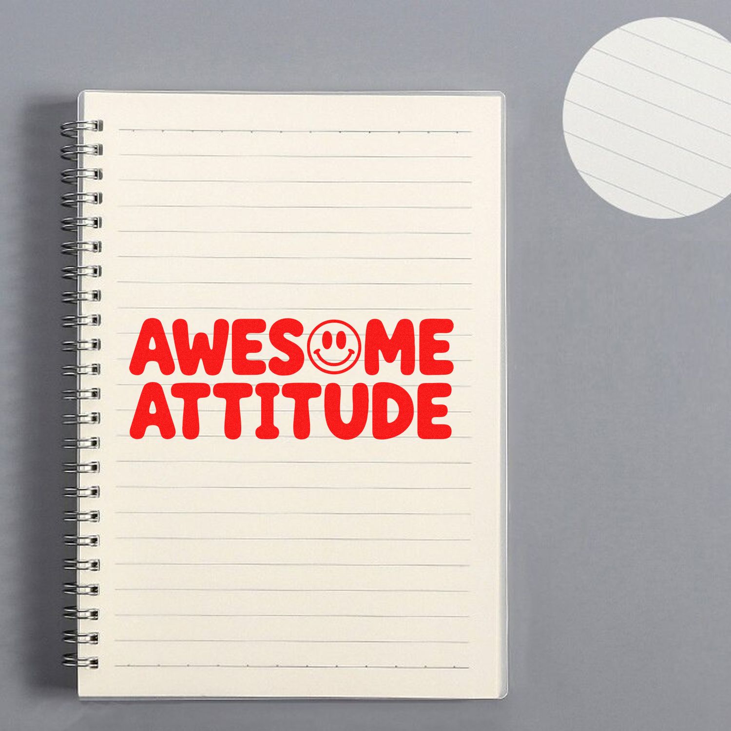 Awesome Attitude rubber stamp design on a notebook, perfect for teachers, planners, office crafts, and motivational stamping.