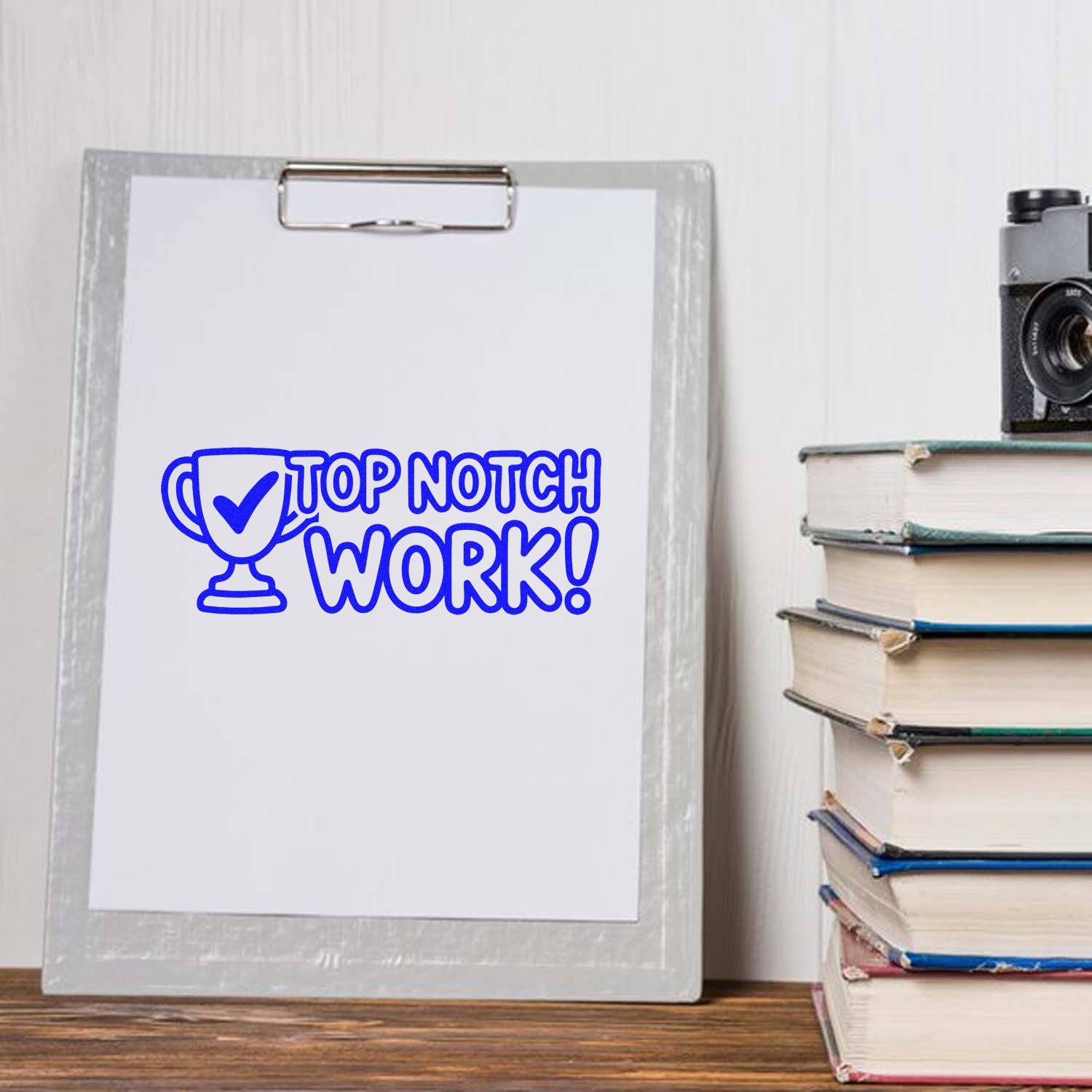 Top Notch Work rubber stamp design mockup on clipboard with trophy icon, ideal for classroom rewards or office praise.