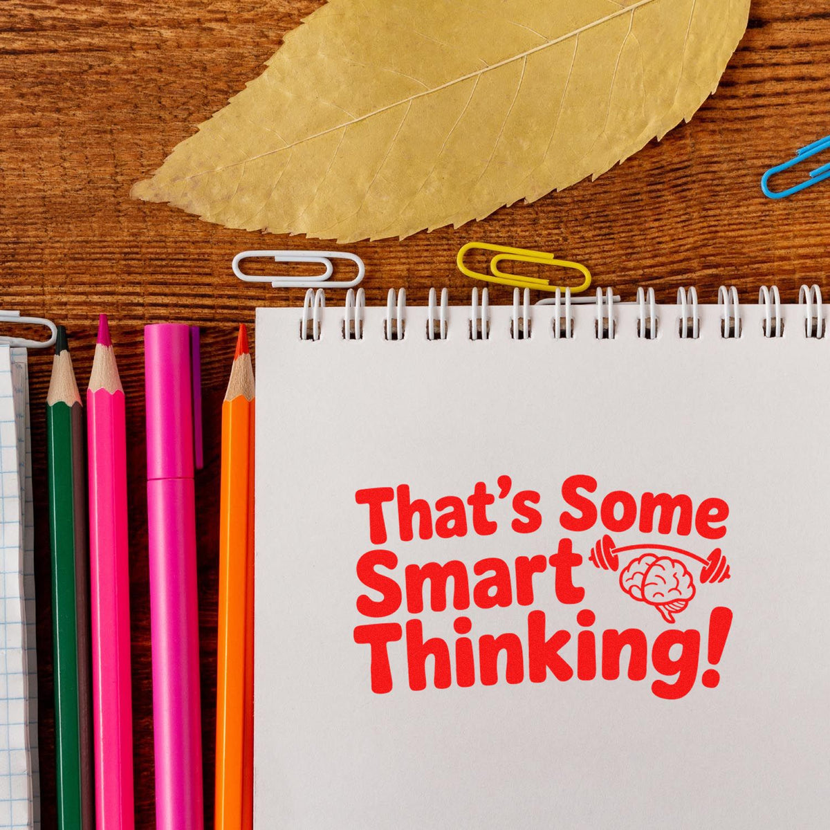 Rubber stamp reading Thats Some Smart Thinking! for classroom or office use, with brain icon and stationery.