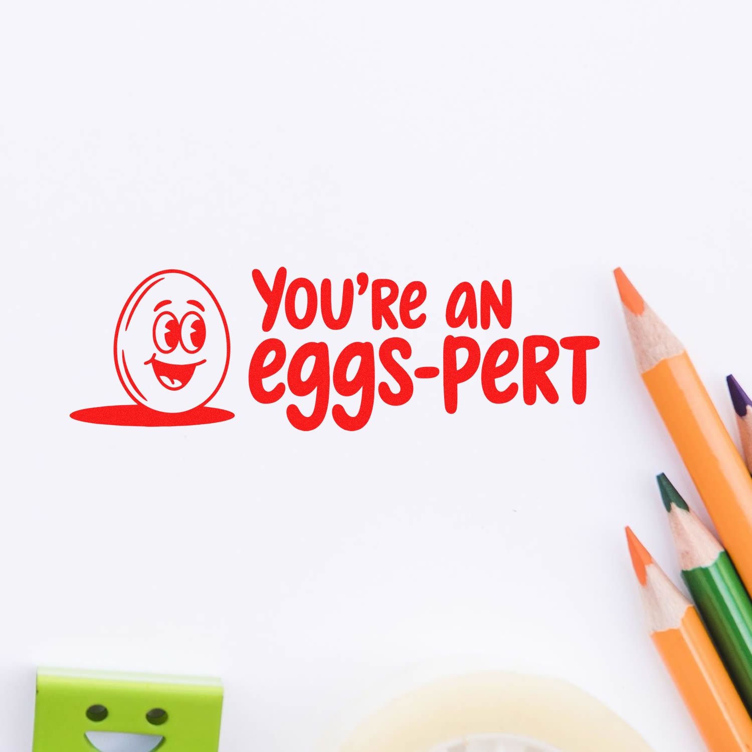 Custom rubber stamp with Youre an eggs-pert quote and egg face design for teachers, Easter cards, and crafts.