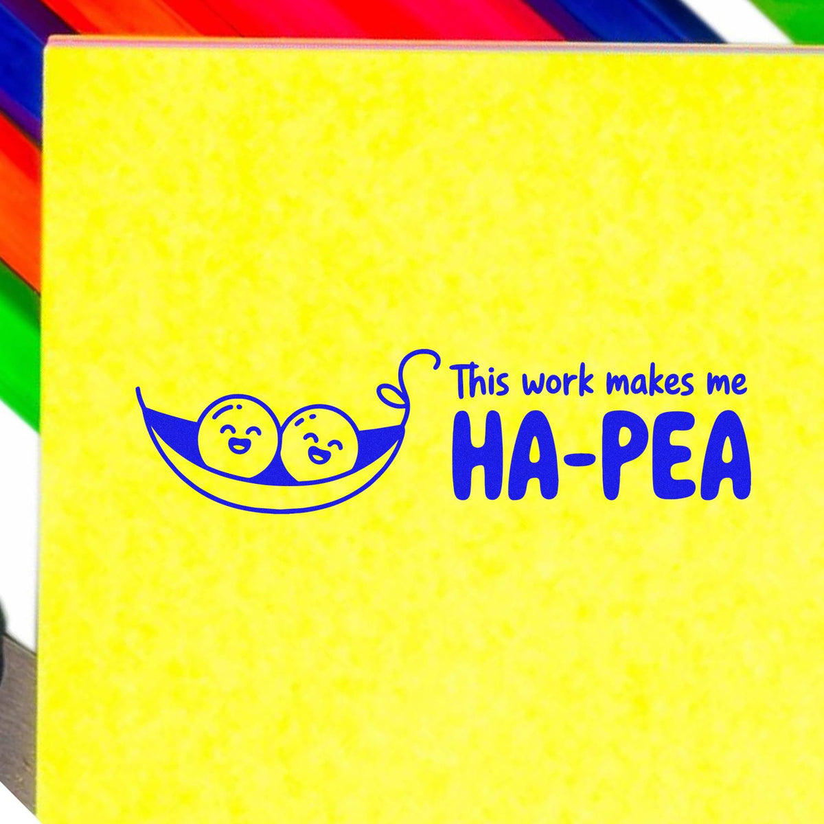 Custom rubber stamp design with peas in a pod and the phrase This work makes me HA-PEA on a yellow background.