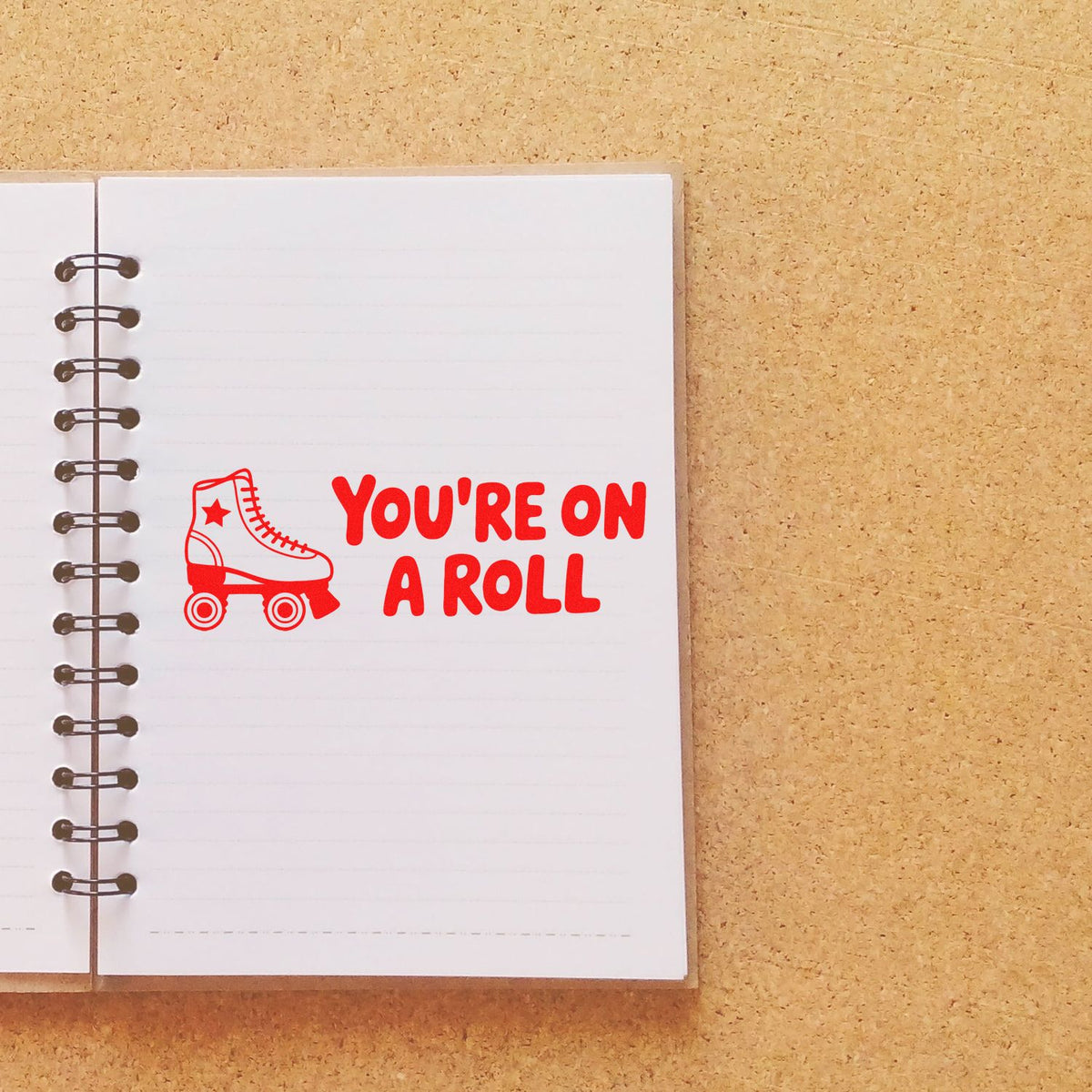 Rubber stamp design with roller skate and Youre on a Roll text for motivational planner, scrapbook, or craft stamping.