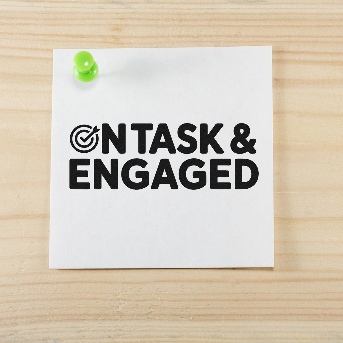 On Task & Engaged rubber stamp impression on paper, perfect for classroom behavior tracking or office productivity.