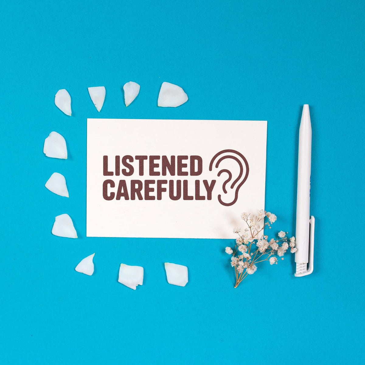 Rubber stamp mockup reading Listened Carefully? with ear icon, ideal for office feedback and teacher marking.
