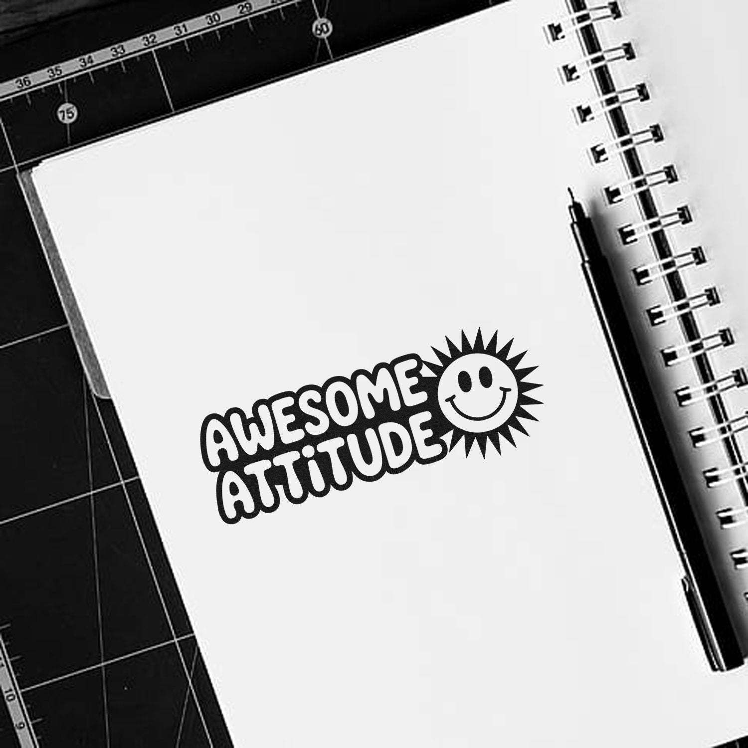 Custom Awesome Attitude rubber stamp design on notebook with smiley sun icon for crafts, journaling, and motivational projects.