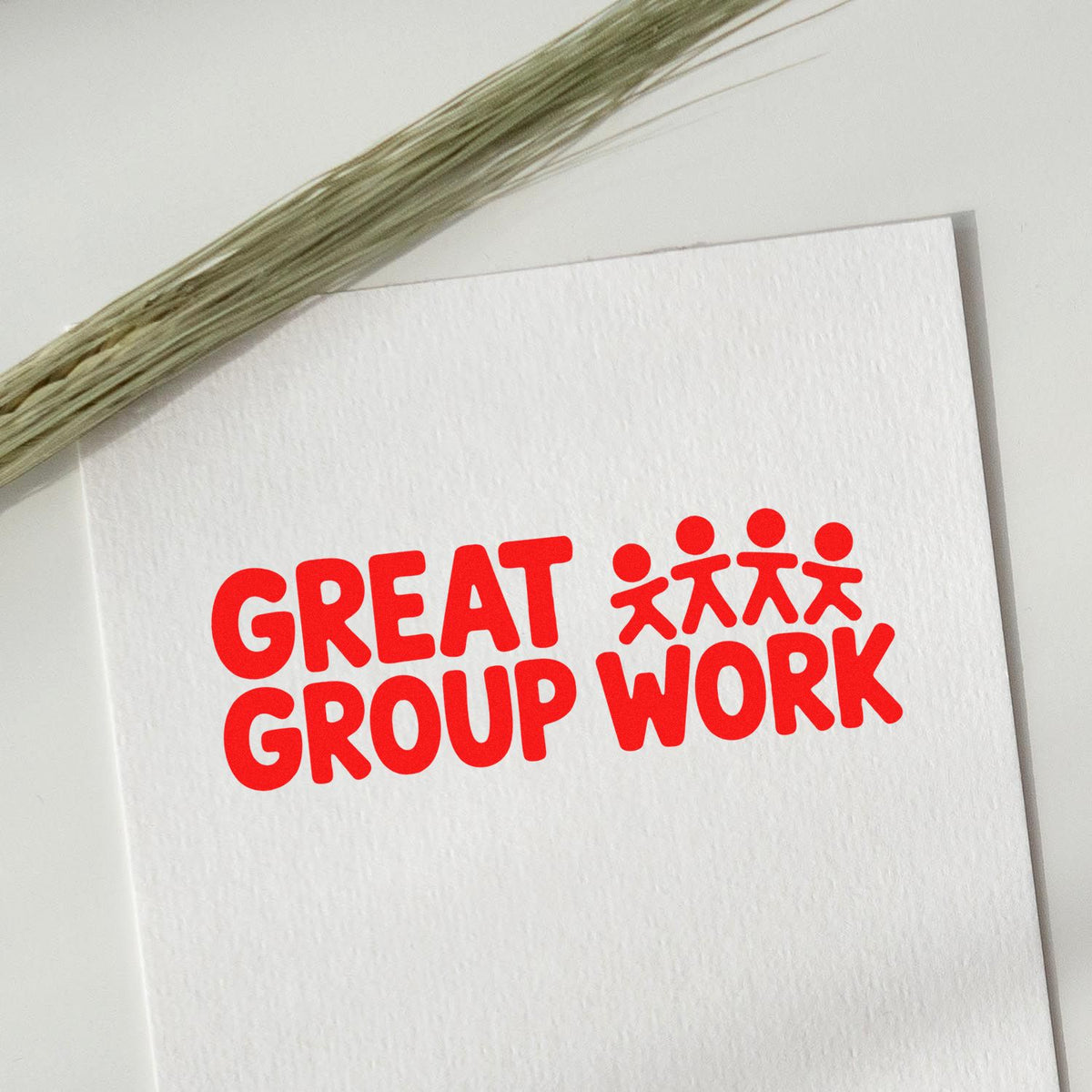 Red Great Group Work rubber stamp imprint with people icon on white card for teacher praise and classroom feedback.