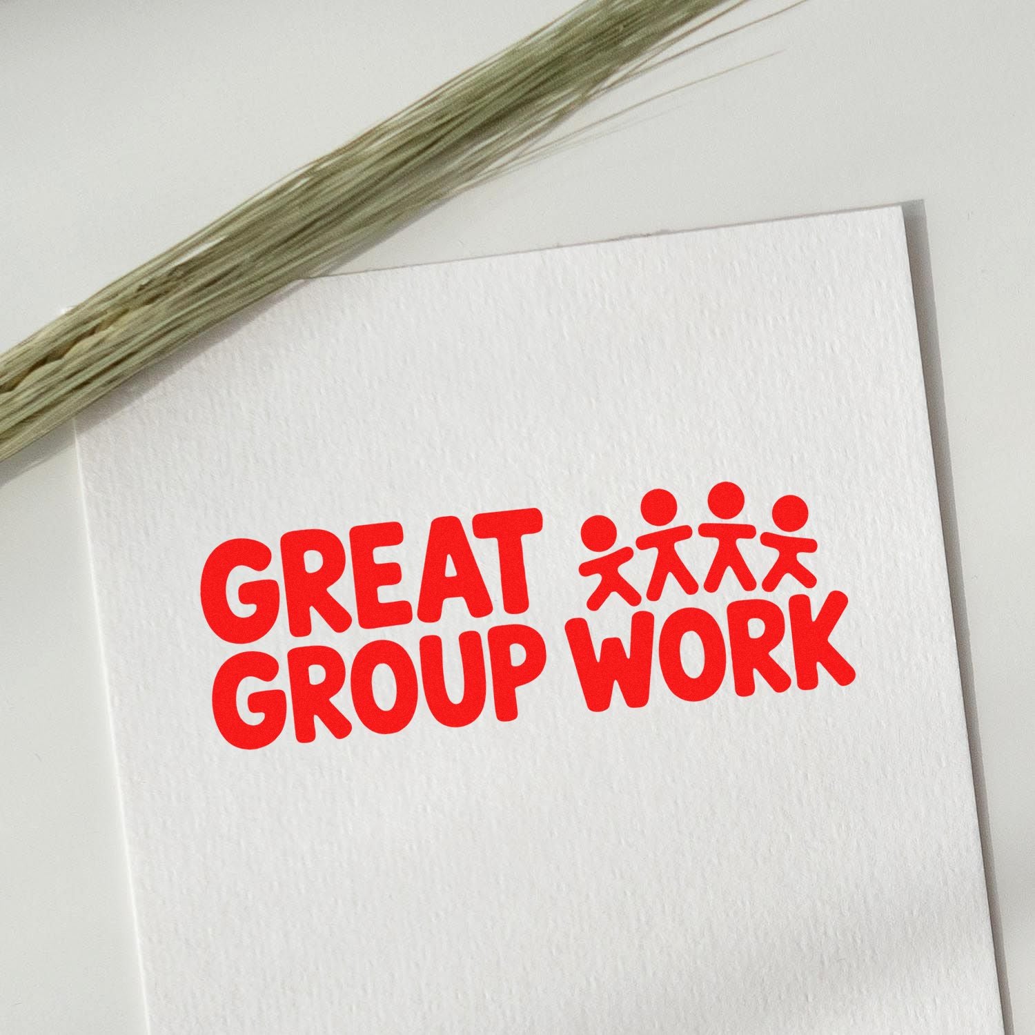 Great Group Work rubber stamp impression in red on white paper, ideal for classroom feedback and team projects.