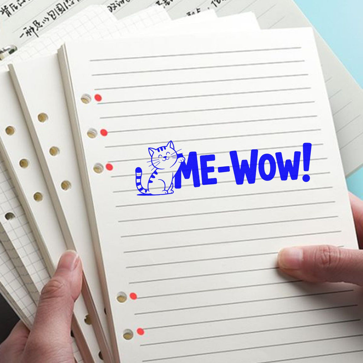 Cat rubber stamp design on lined notebook paper, featuring a playful ME-WOW! message for stationery and journaling.