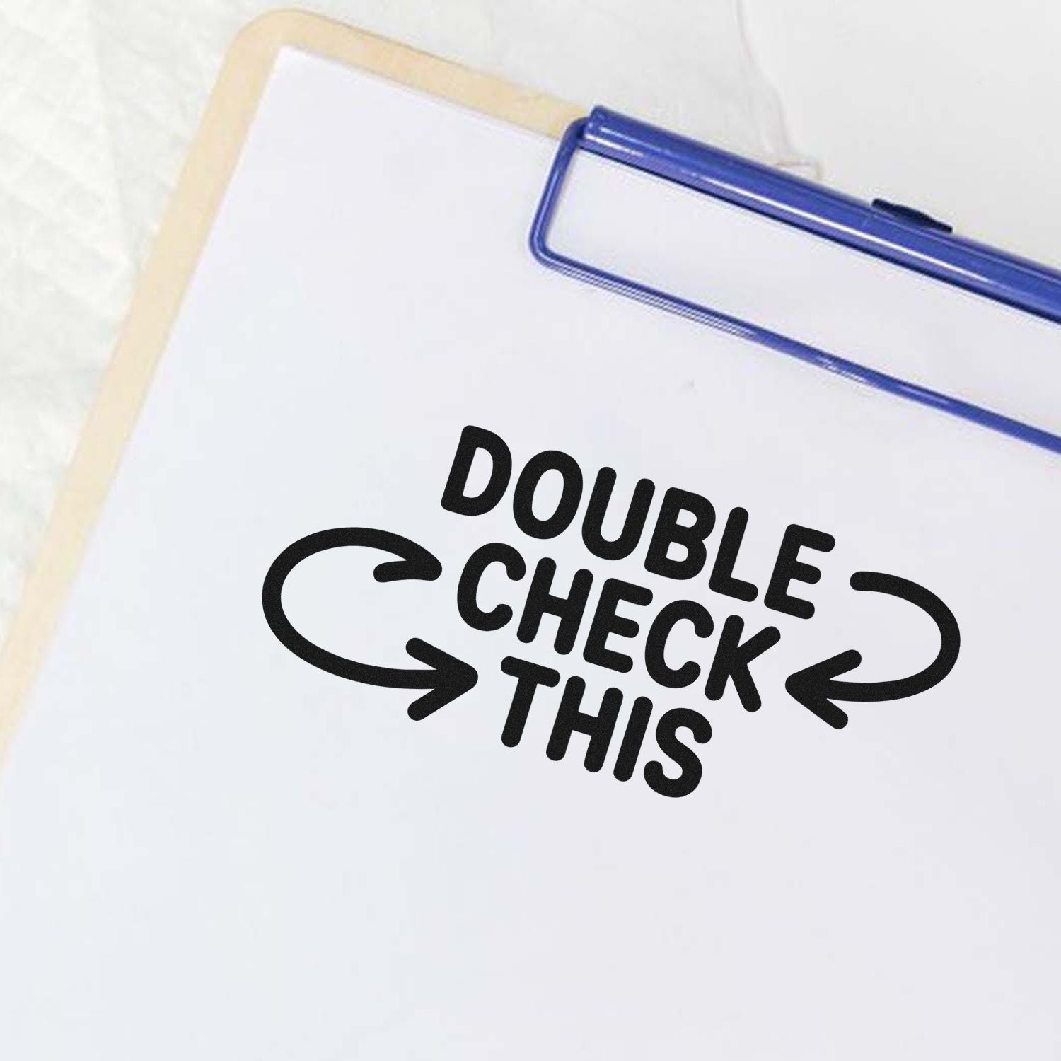 Double Check This rubber stamp on clipboard for office proofing and document review.