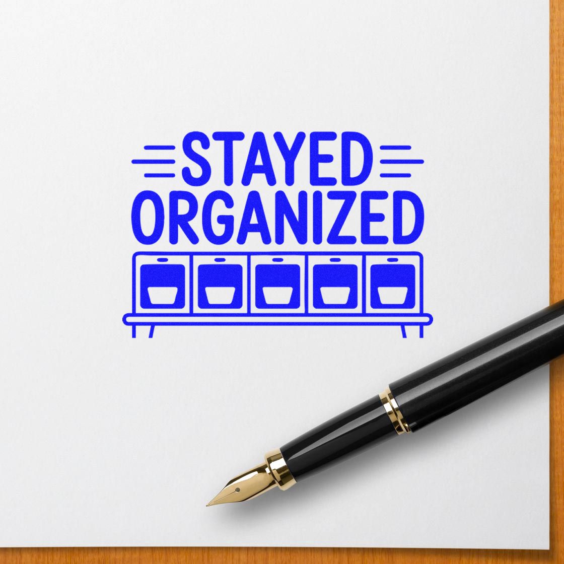Blue rubber stamp reading STAYED ORGANIZED with shelf icon for planners, office filing, and productivity.